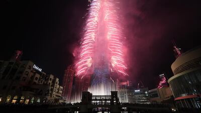 Fireworks illuminate the sky around Burj Khalifa. EPA