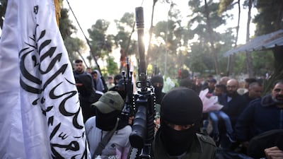 Members of Palestinian terror group Lions' Den visit graves of deceased members. EPA