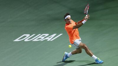 Federer displays his perfect technique as he returns a slice backhand to Djokovic. Ahmed Jadallah / Reuters