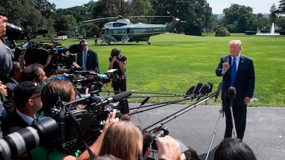 US President Donald Trump speaks as he departs the White House in Washington, DC, on October 2, 2018. AFP