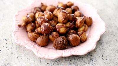 Lgeimat, saffron flavoured fritters prepared by Shaikha Al Ali. Sarah Dea / The National