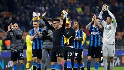 Inter Milan players applaud fans at the end of the match. AP