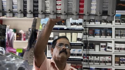 The choice of cigarettes in an Abu Dhabi shop, but a World Health Organisation report raises questions over pricing. Silvia Razgova / The National