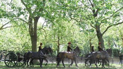 Members of the King's Troop Royal Horse Artillery ride during a 82-gun double gun salute in Green Park. EPA