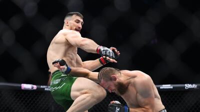 Modestas Bukauskas of Lithuania knees Marcin Prachnio of Poland on his way to a submission victory in their light heavyweight bout. Getty Images