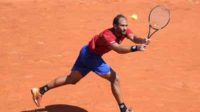 Egypt's Mohamed Safwat plays a return to Bulgaria's Grigor Dimitrov at the 2018 French Open. Getty