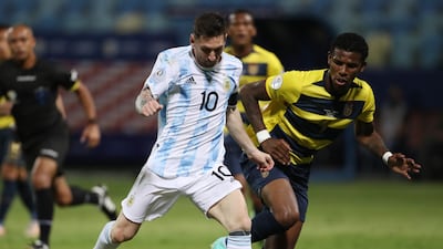 Lionel Messi in action with Ecuador's Robert Arboleda.