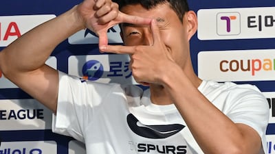 Tottenham Hotspur's South Korean striker Son Heung-min does his signature pose. AFP