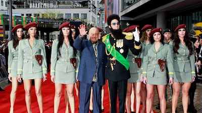 Mr Al-Fayed with Sacha Baron Cohen, dressed as his alter-ego Admiral General Aladeen, attending the premiere of The Dictator in London in 2012. Getty Images
