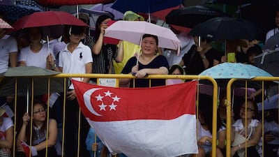 Along the way, crowds of people chanted ‘Lee Kuan Yew’ and waved Singapore’s flag. Ed Wray/Getty Images