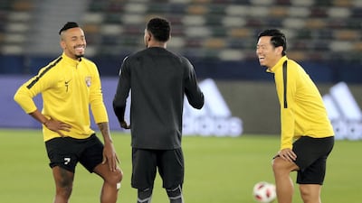 Caio, goalkeeper Khalid Essa (back to camera) and Tsukasa Shiotani were in good spirits during training.
