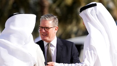 Mr Starmer is welcomed to Sheikh Zayed Grand Mosque in Abu Dhabi. Reuters
