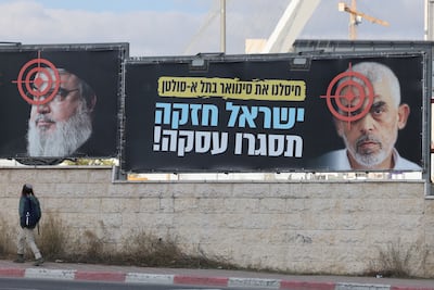 Billboards in Jerusalem bearing images of the late Hezbollah and Hamas leaders and reading: 'We eliminated Sinwar. Israel is strong, close a deal!' EPA