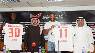 Felipe Caicedo, left, and Jucilei da Silva, second from right, standing with Ayedh Mabkhout,, second from left, and Ali Al Nuaimi at the unveiling ceremony of the players at Al Jazira Club on Friday. Courtesy Al Jazira Club