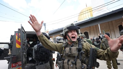 Israeli soldiers take position during a protest to mark the 'Land Day' in Huwara village, near the West Bank city of Nablus. EPA