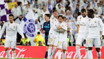 Real midfielder Fede Valverde (C) celebrates with his teammates after giving his side a 2-1 lead against Real Sociedad. EPA