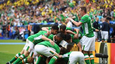 Republic of Ireland players celebrate their team’s first goal by Wes Hoolahan (obscured) during the Uefa Euro 2016 Group E match between Republic of Ireland and Sweden at Stade de France on June 13, 2016 in Paris, France. (Matthias Hangst/Getty Images)