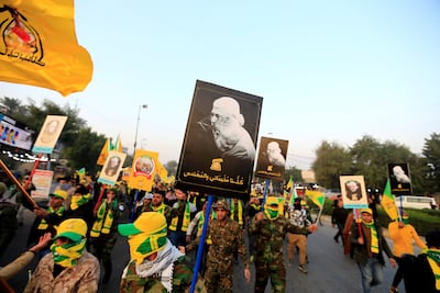 Kataib Hezbollah militia members gather for the funeral of a commander in 2020. Reuters