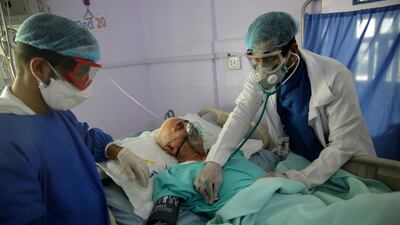 Medical workers attend to a Covid-19 patient in an intensive care unit at a hospital in Yemen. The World Bank says the pandemic threatens to rollback gains made in human capital development over the past decade. AP.