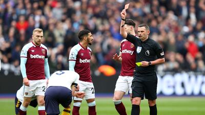 Michael Oliver shows a red card to Everton's Michael Keane. Getty