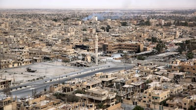 A picture taken from a helicopter during a press tour provided by the Russian Armed Forces on September 15, 2017 shows an aerial view of the modern city of Palmyra, in Syria's central province of Homs. AFP