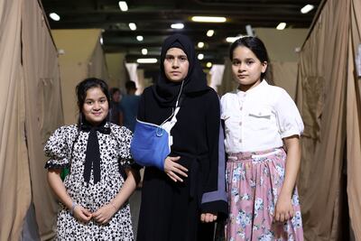 Kefah Zaid Hassan and her two daughters survived an Israeli strike that killed 19 of their loved ones. Chris Whiteoak / The National
