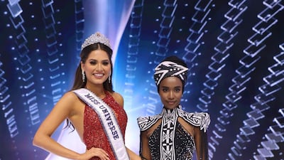 Miss Universe 2020 Andrea Mesa and Miss Universe 2019 Zozibini Tunzi pose onstage at the Miss Universe 2020 Pageant at Seminole Hard Rock Hotel & Casino on May 16, 2021 in Hollywood, Florida. AFP