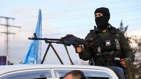 A member of the Kurdish Internal Security Forces watches as a government delegation visits Qamishli International Airport in north-east Syria to reopen it on February 8. Reuters