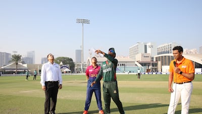 Mahfuzur Rahman, captain of Bangladesh, and UAE skipper Aayan Afzal Khan during the toss.