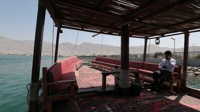 A boat used to take tourists to the pearl farm.