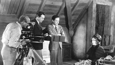 Irving Thalberg (dark jacket), the producer and "boy wonder" at MGM, and the director King Vidor watch a cameraman shoot Lilian Gish, probably for the 1926 movie version of La Bohème.