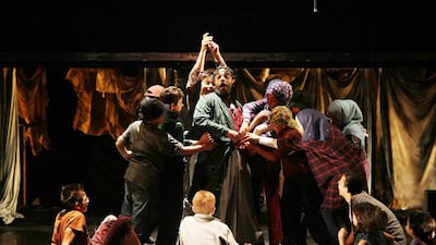 The amateur cast comprised of Jordanian and Syrian refugees act in a scene of an Arabic adaptation of 'Oliver'. Salah Malkawi for The National