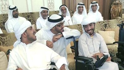 Sheikh Mohammed bin Zayed, Crown Prince of Abu Dhabi and Deputy Supreme Commander of the Armed Forces, talks to Yousef Al Kithiri, left, and Saeed Al Mansoori, students at the Abu Dhabi Centre for Special Needs, during their meeting. Courtesy Nawal Al Ameri
