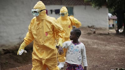 Nowa Paye, 9, is taken to an ambulance after showing signs of the Ebola. Aid donations are still inadequate, as the international community tries to increase the ability to care for the spiralling number of people with the disease that has hit Liberia the hardest.