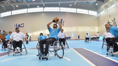 Sheikh Hamdan bin Mohammed, the Crown Prince of Dubai,, centre, took part in a friendly match between a Dubai government team and the UAE national wheelchair basketball team on April 16, 2014. Courtesy Government of Dubai Media Office