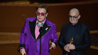 British singer-songwriter Elton John and British lyricist Bernie Taupin accept the award for Best Original Song for '(I'm Gonna) Love Me Again, 'Rocketman' at the 92nd Academy Awards on Sunday, February 9. AFP