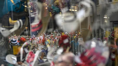Government supporters, reflected in a storefront window, protest against US sanctions as they celebrate May Day in Caracas, Venezuela, amid the coronavirus pandemic. AP Photo