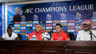 Al Ahli coach Cosmin Olaroiu, second left, and Ahmed Khalil, left, shown at a press conference prior to the Asian Champions League semi-final first leg in Riyadh. Photo Courtesy / Asian Football Confederation / September 28, 2015