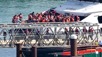 A group of people thought to be migrants are brought in to Dover, Kent, from a Border Force vessel following a small boat incident in the Channel. Photo: PA