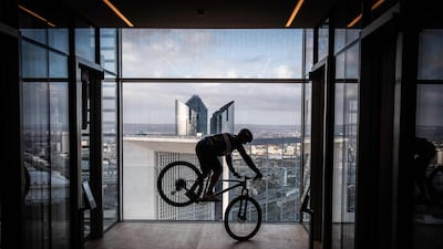 French rider Aurelien Fontenoy climbs the 768 steps of the 33 floors of the 140-metre-high Trinity Tower in the business district of La Defense, west of Paris, on Sunday, January 17. AFP
