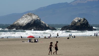 People visit Ocean Beach during the coronavirus outbreak in San Francisco. AP Photo
