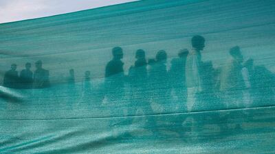 Supporters of Afghan presidential candidate Zalmai Rassoul arrive for an election campaign in Bagram. Ahmad Masood / Reuters