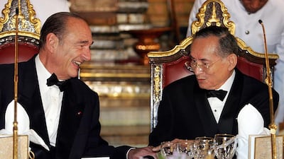 Then French president Jacques Chirac, left, speaking to the Thai king at a gala dinner at the Royal Palace in Bangkok on February 17, 2006. Remy de la Mauviniere / AFP