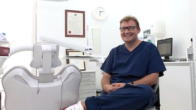 Dr Neil Mitchell at his practice in Downtown Dubai. He feels that he has more family time in the UAE compared to the UK. Jeffrey E Biteng / The National