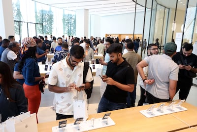 The Apple Store in Dubai Mall. The iPhone maker helped drive the premium device segment in the UAE in the second quarter of 2026. Chris Whiteoak / The National