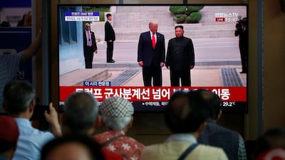South Koreans watch a television broadcasting news of the event. EPA