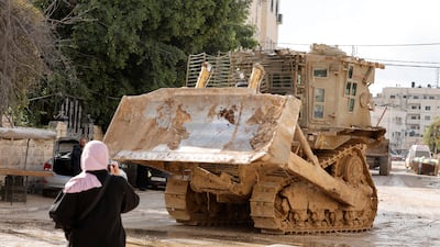 An Israeli military vehicle drives on the street during an Israeli raid, in Jenin in the Israeli-occupied West Bank. Reuters
