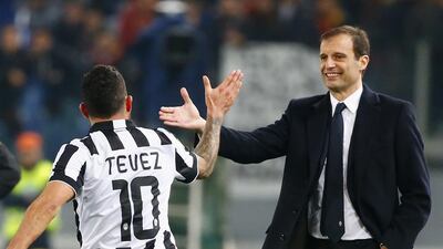 Under Massimiliano Allegri, right, Carlos Tevez and Juventus have crossed the Uefa Champions League ceiling. Tony Gentile / Reuters