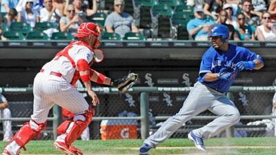 Chicago's Tyler Flowers runs out to tag Edwin Encarnacion of the Toronto Blue Jays