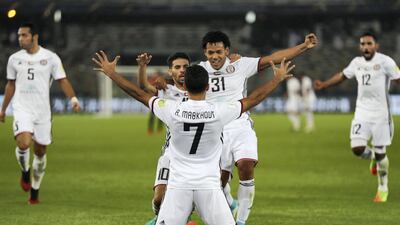 Ali Mabkhout of Al-Jazira celebrats scoring his sides 1st goal with teammates Mbark Boussoufa, and Romarinho of Al-Jazira during the FIFA Club World Cup match between Al Jazira and Urawa Red Diamonds at Zayed Sports City Stadium on December 9, 2017 in Abu Dhabi, United Arab Emirates. (Photo by Francois Nel/Getty Images )